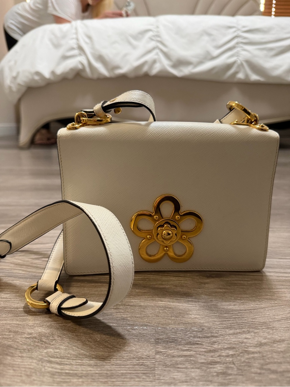 Prada Women's Ivory Leather Shoulder Bag with Gold Floral Accent